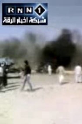 Aftermath &#8230; the strike area is all billowing black smoke in this video image after the attack on the petrol station.