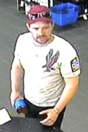A still from CCTV footage showing a man believed to have used a stolen credit card.