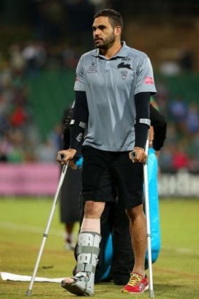 Inglis leaves the pitch on crutches.