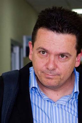 "Very relieved" ... Senator Nick Xenophon arrives at Tullamarine Airport after being deported from Malaysia.