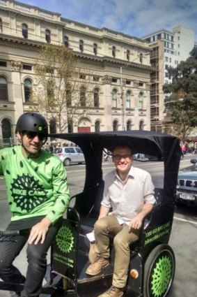 Greens MP Adam Bandt in a Bike Cab.