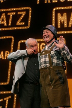 Mel Brooks (left) and Bert Newton (right) ham it up on stage at the Princess Theatre during <i>The Producers</i>.