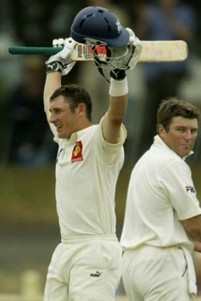 David Hussey celebrates his double-century against the Blues in January, 2004.
