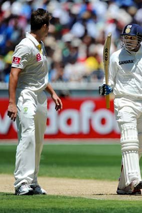 James Pattinson and Virender Sehwag exchange words after nearly colliding during the Boxing Day Test.