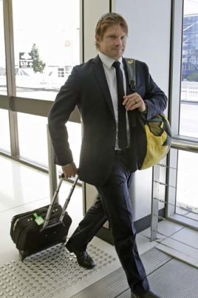 India calling: Shane Watson at Sydney airport on Monday.