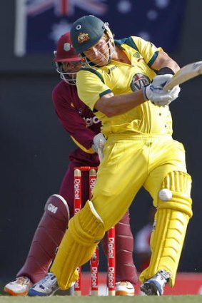 Take that: Shane Watson lets fly against the West Indies.