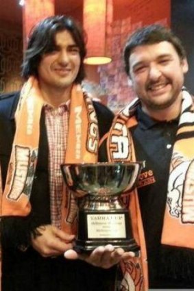 Former Ice stars, Joey and Vinnie Hughes, show off the Yarra Cup after the Mustangs' upset win in the Melbourne derby.