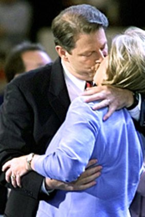 Vice President and Democratic presidential candidate Al Gore kisses his wife Tipper as he arrives on stage during the final evening session of the Democratic National Convention in 2000.