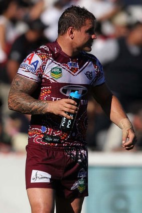 Worrying signs: Anthony Watmough hobbles off injured for the Sea Eagles.