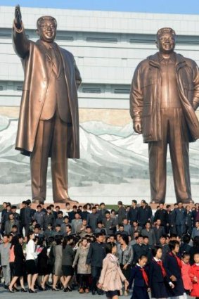 Statues of North Korean leaders Kim Il-sung (left) and Kim Jong-il on the 69th anniversary of the founding of the Workers' Party of Korea.