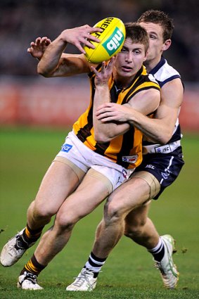 Caught: Joel Selwood tackles Liam Shiels.