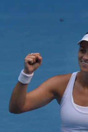 Casey Dellacqua celebrates her victory over China's Zheng Jie.