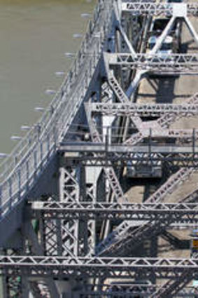 Brisbane City Council workers brave hot temperatures on the weekend to resurface the road on the Story Bridge. The bridge was last resurfaced 20 years ago.