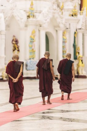 Tread lightly … Buddhist monks in a temple.