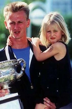 The girl ... with her father, Petr, after he won the 1998 Australian Open.