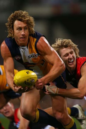 On the run: West Coast'sMatt Priddis looks for support.