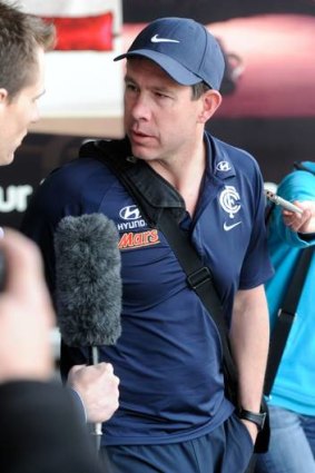 Carlton coach Brett Ratten arrives back in Melbourne after the loss to Gold Coast Suns.