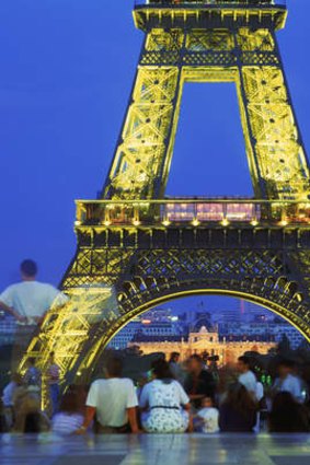 The Eiffel Tower from the Trocadero at night in Paris.