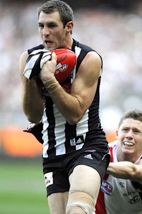 Travis Cloke marking in front of Zac Dawson in the grand final replay.