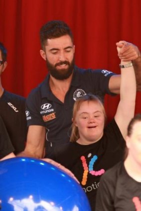 Up the Blues: Carlton’s Kade Simpson joins the fun at World Down Syndrome Day on Friday.