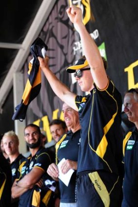 Richmond's Jack Riewoldt is presented with his jumper at Sunday's family day.