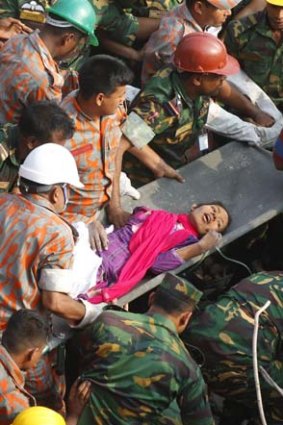 Rescue workers pull Reshma alive from the rubble.