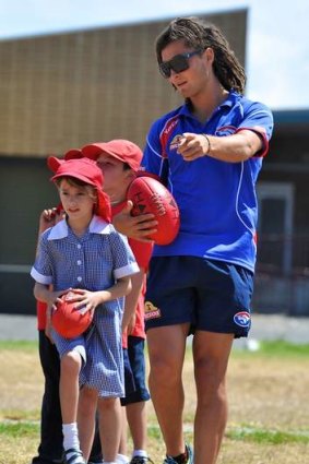 School's in: Luke Dahlhaus passes on some tips to children at an Altona primary school on Monday.