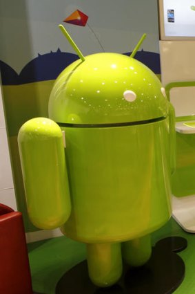 One of Androidland's giant green alien mascots.