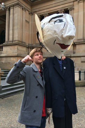 Student Tom Harman with an effigy of Prime Minister Tony Abbott at a rally against proposed changes to higher education,