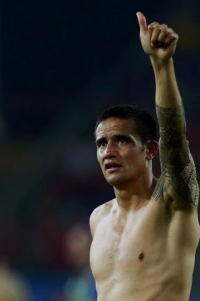 Australia's Tim Cahill acknowledges the fans after their loss to Chile.