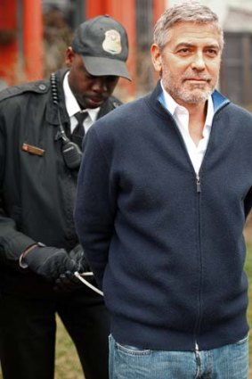 Actor and activist ... a member of the US Secret Service arrests George Clooney.