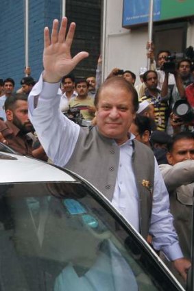 Nawaz Sharif arrives to cast his vote in the general election in Lahore in May 2013.