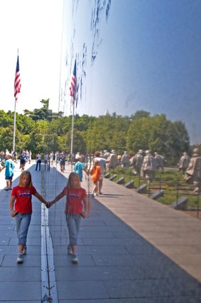 Change of focus ... a girl's image reflected in the Korean War Veterans Memorial.