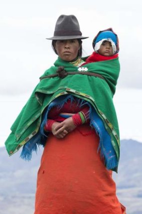 An Ecuadorian highlands woman and child in traditional costume.