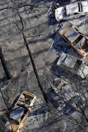 Burnt-out shells of cars in the Gippsland town of Callignee following the Black Saturday fires.