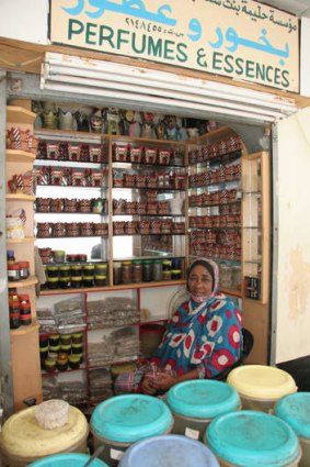 A woman in perfume souk in Salalah.
