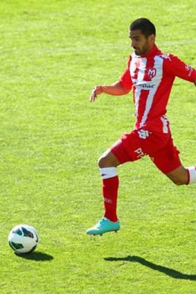 Leaps and bounds: Melbourne Heart's Aziz Behich in action.