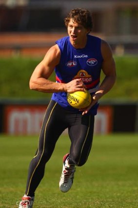 Back in the ruck: Bulldog Will Minson strides out at training yesterday.