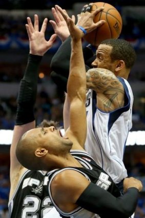 Up in arms: Monta Ellis drives past Patty Mills.
