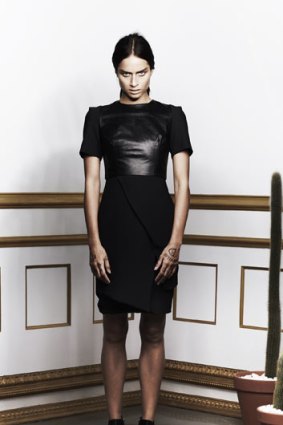 A model wears an Ellery wrap skirt with leather bodice.