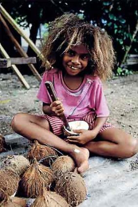Preparing coconuts on the Lau Islands.