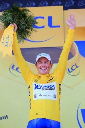 Winning edge: Australian Simon Gerrans celebrates taking the lead at the Tour de France after the team time trial.