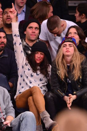 Michelle Rodriguez and Cara Delevingne attend the Detroit Pistons vs New York Knicks game.