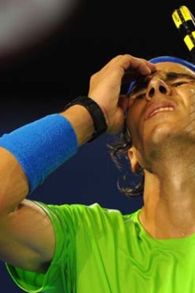 Heavy blow ... Spain's Rafael Nadal puts up a valiant fight but in the end it wasn't enough.