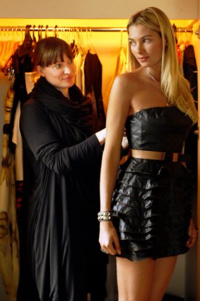 "Jess loves this one": stylist Kirsty McBeth helps Jessica Hart as she tries on a Manning Cartel micro-mini.