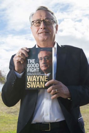 Wayne Swan poses near his offices in Nundah with a copy of his book, <i>The Good Fight</i>.