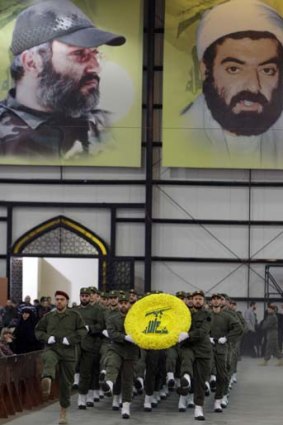 Hezbollah fighters parade on Hezbollah martyr day in Beirut, Lebanon. The Iranian Intelligence Minister, Heydar Moslehi said 12 alleged US spies were captured.