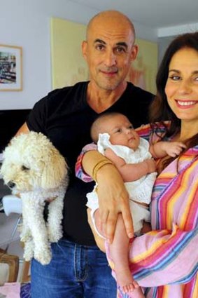 Delighted: Mary Coustas, husband George Betsis and baby girl Jamie at home.