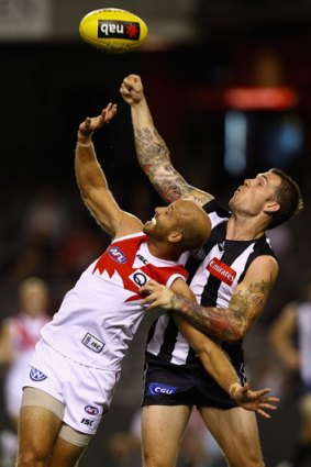 Eyes on the ball: Swans co-captain Jarrad McVeigh in action against Collingwood in the NAB Cup.