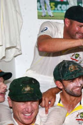 Hard-urned thirst: Ryan Harris gets the party under way on Tuesday by pouring a beer over fellow quick Mitchell Johnson.